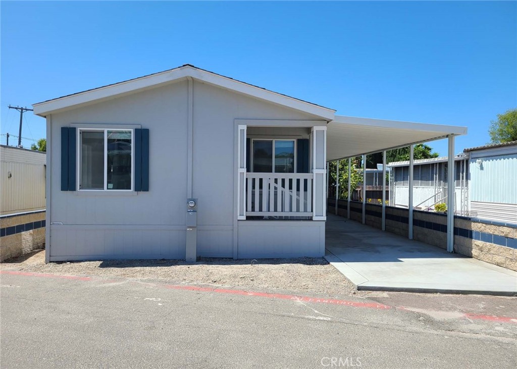3030 Oceanside Boulevard, Unit 28 Oceanside, CA 92054 - Photo 1 of 1 a front view of a house with a garage