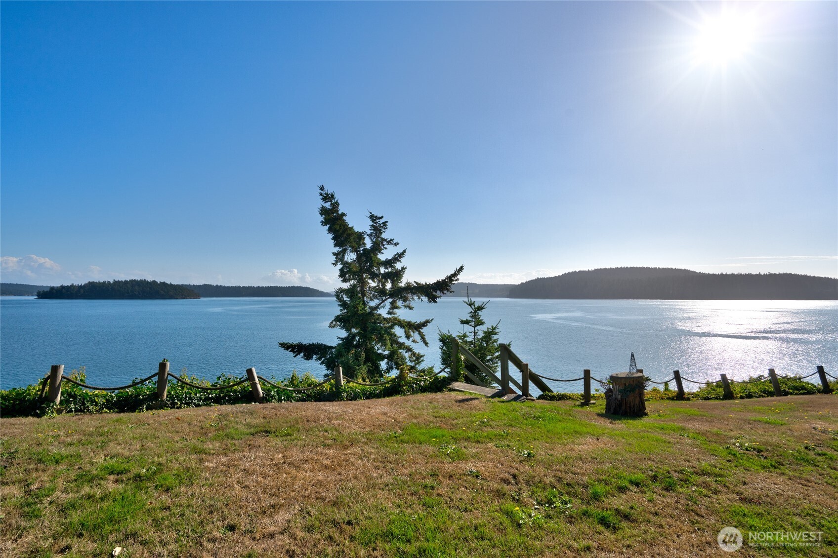 6860 Salmon Beach Road Anacortes, WA 98221 - Photo 15 of 40 a view of a lake with a house in the background
