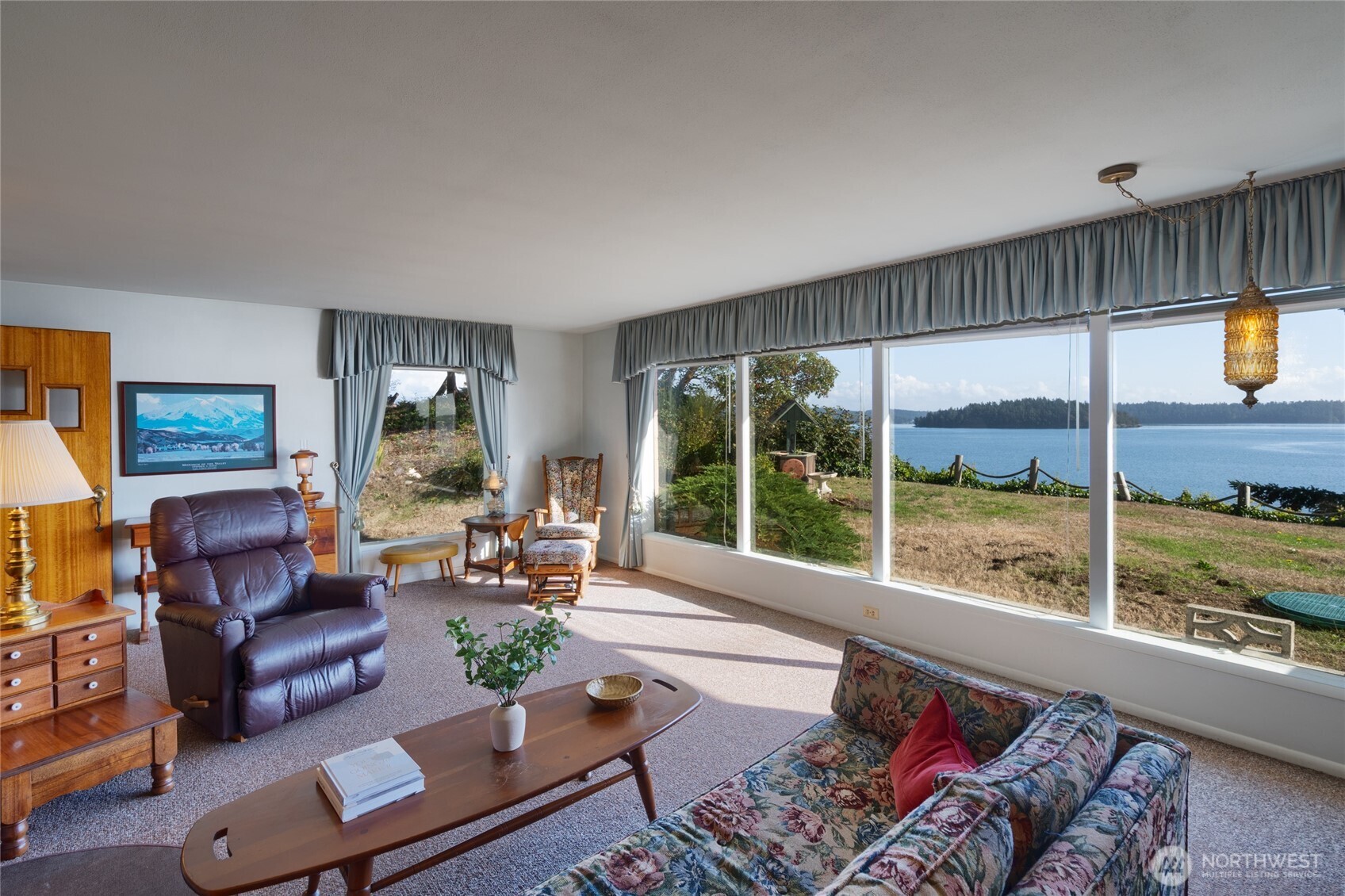 6860 Salmon Beach Road Anacortes, WA 98221 - Photo 16 of 40 a living room with furniture and a large window