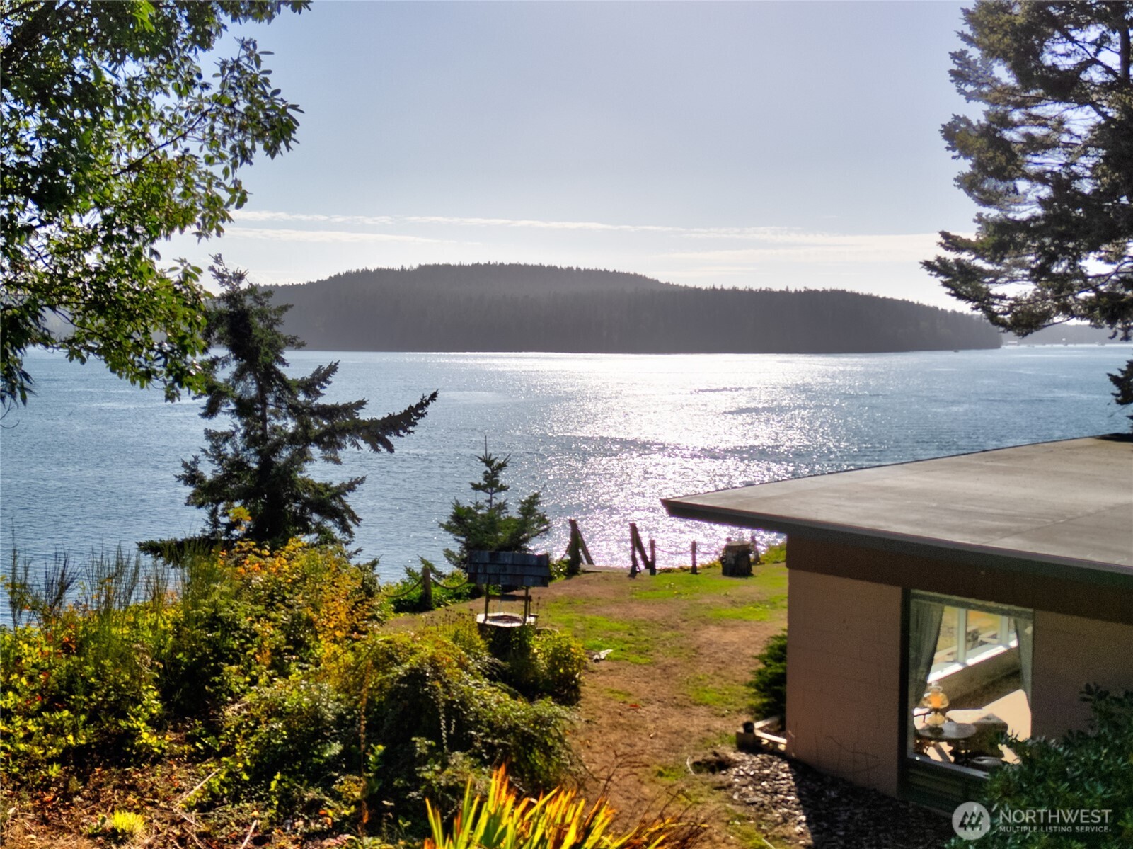 6860 Salmon Beach Road Anacortes, WA 98221 - Photo 17 of 40 a view of a lake with a mountain in the background