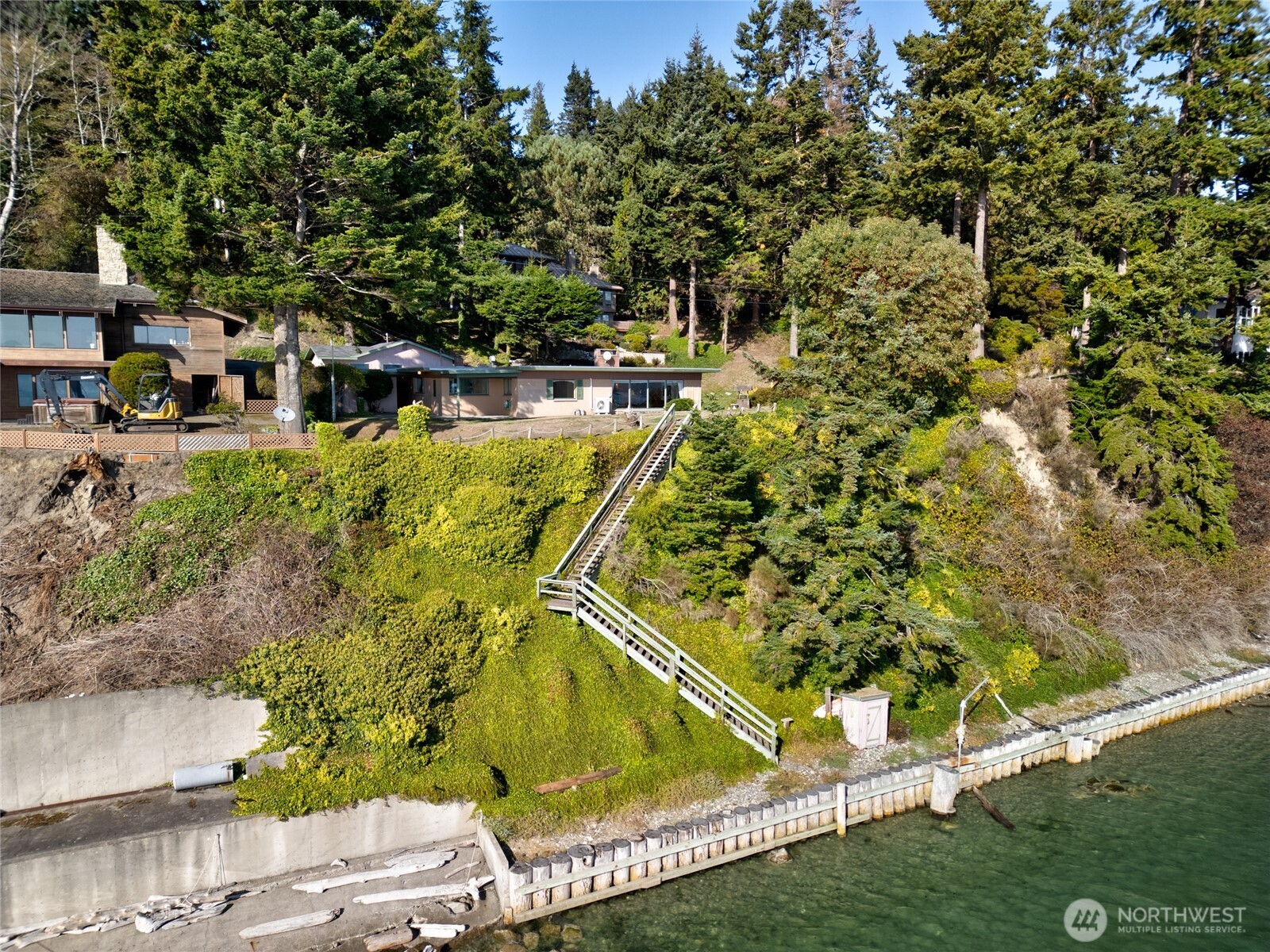 6860 Salmon Beach Road Anacortes, WA 98221 - Photo 18 of 39 a view of swimming pool with lawn chairs and plants
