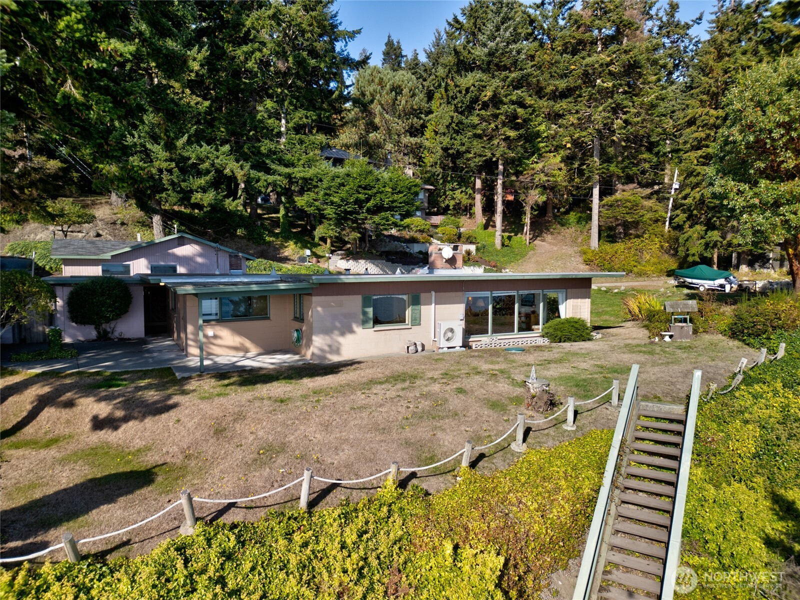 6860 Salmon Beach Road Anacortes, WA 98221 - Photo 20 of 40 a view of a house with a yard and sitting area
