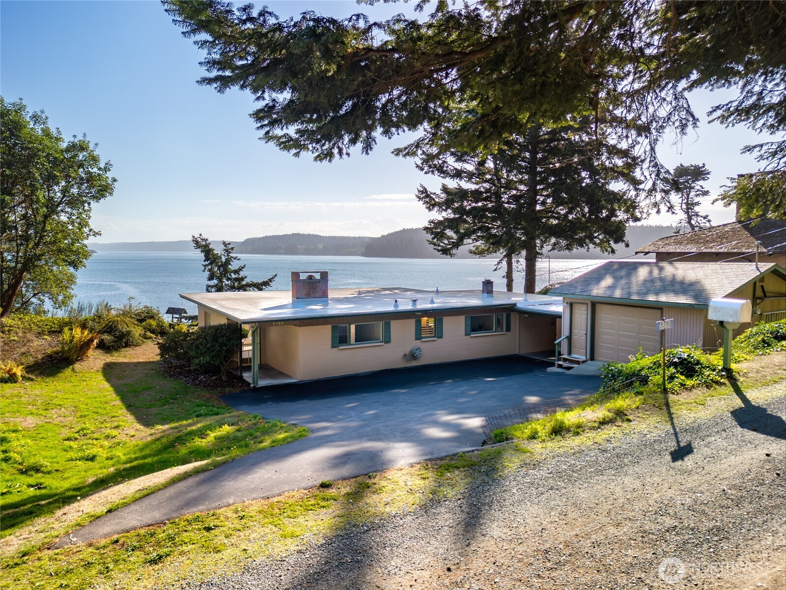6860 Salmon Beach Road Anacortes, WA 98221 - Photo 2 of 39 a view of a house with pool yard and sitting area