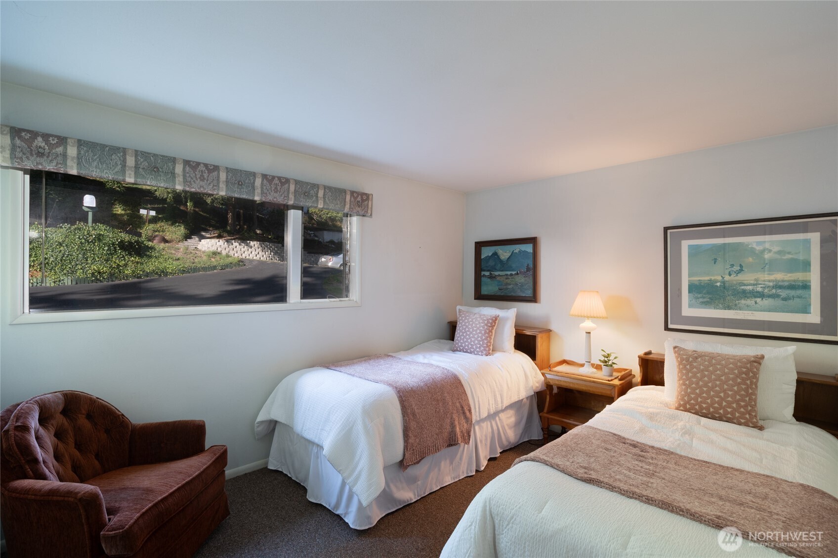 6860 Salmon Beach Road Anacortes, WA 98221 - Photo 31 of 39 a bedroom with two beds and painting on the wall