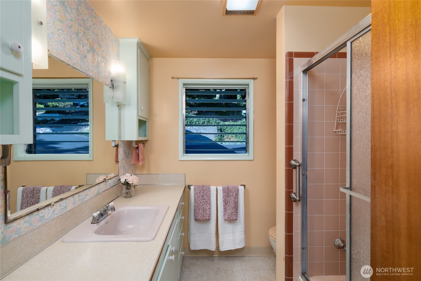 6860 Salmon Beach Road Anacortes, WA 98221 - Photo 34 of 40 a bathroom with a sink and a mirror