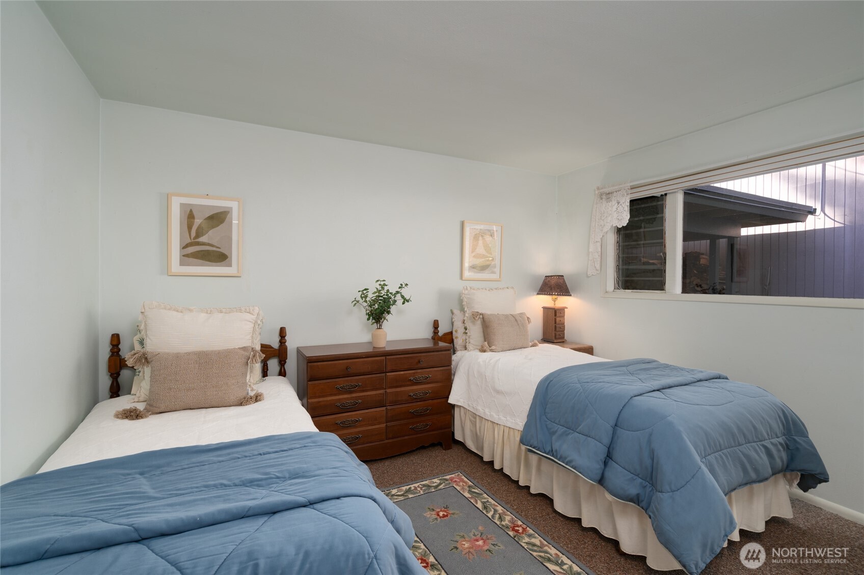 6860 Salmon Beach Road Anacortes, WA 98221 - Photo 35 of 40 a spacious bedroom with a bed and window