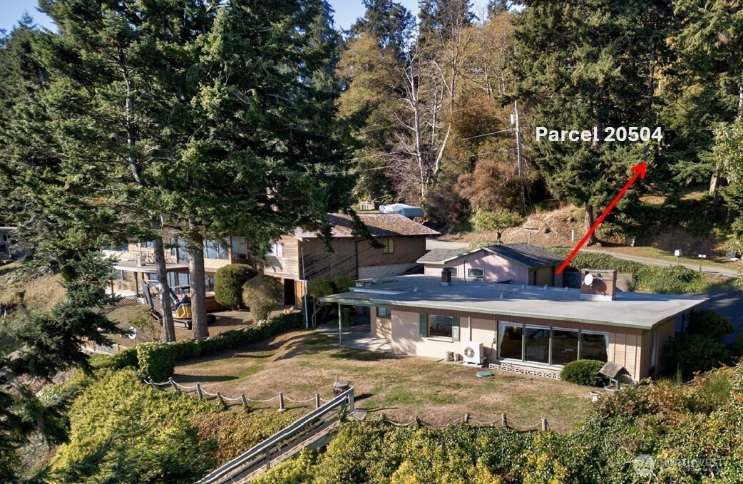 6860 Salmon Beach Road Anacortes, WA 98221 - Photo 7 of 40 a front view of a house with a yard