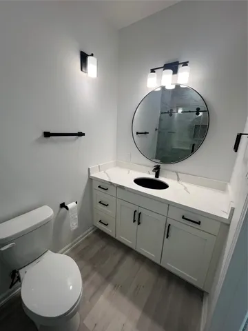 a bathroom with a shower and toilet