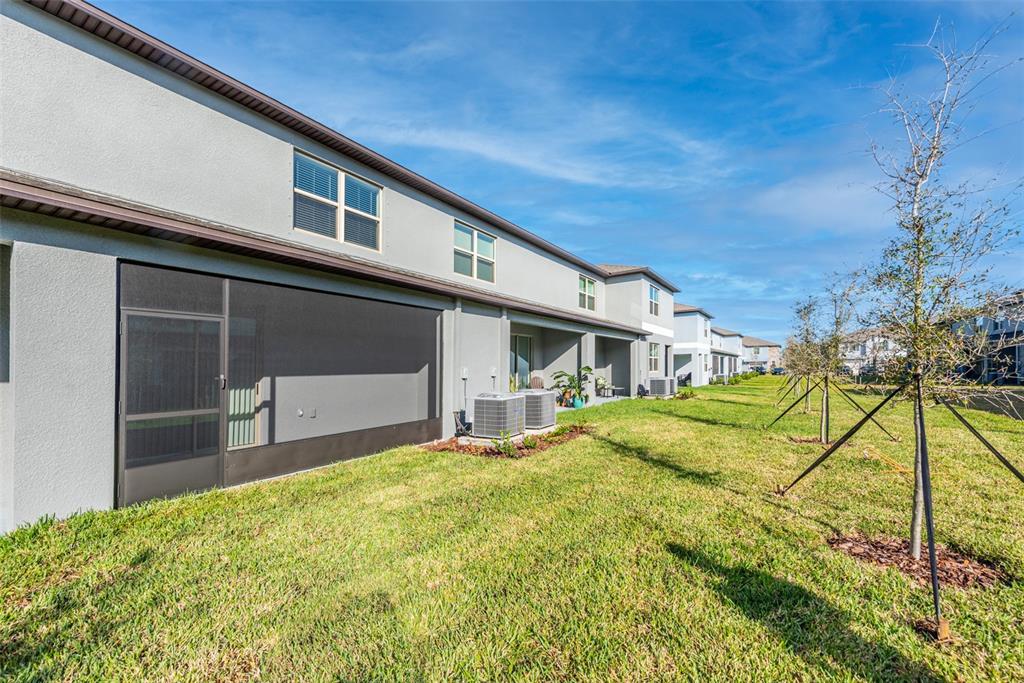 14348 Editors Note Street Ruskin, FL 33573 - Photo 21 of 24 a house view with a backyard space