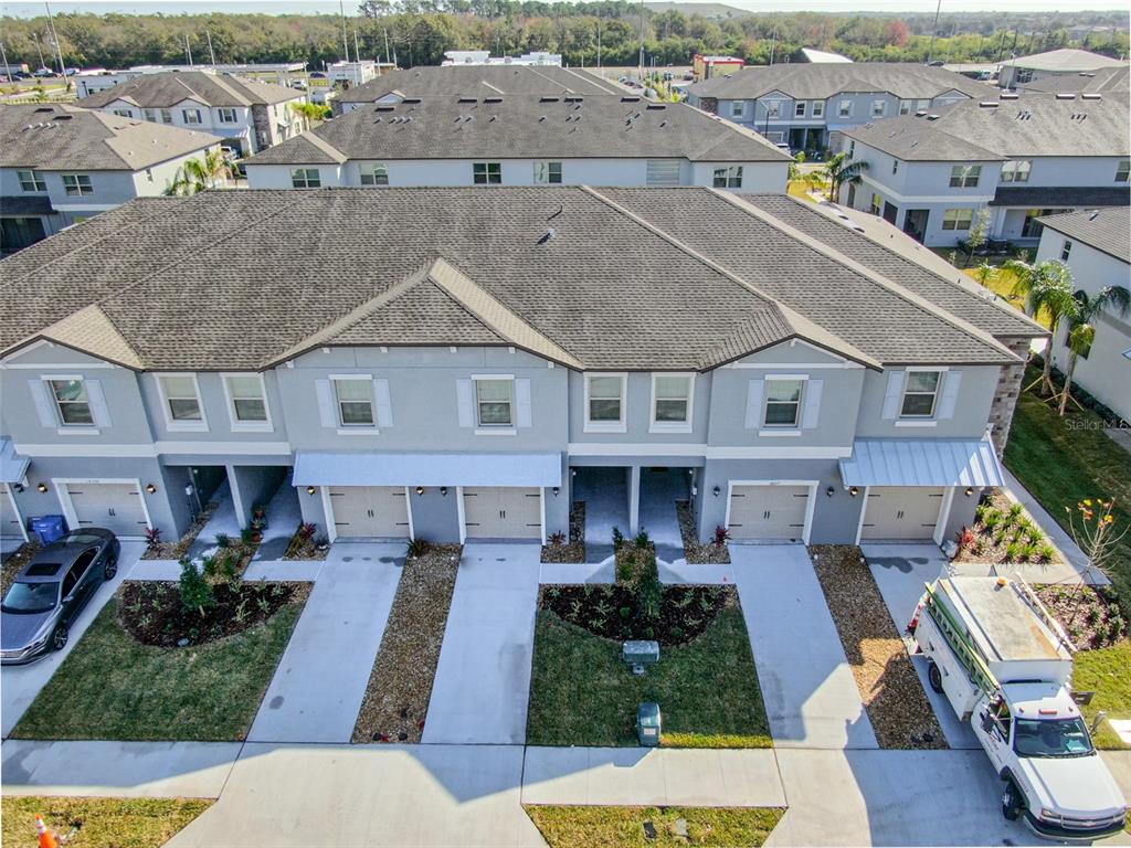 14348 Editors Note Street Ruskin, FL 33573 - Photo 23 of 24 a view of multiple houses with a yard