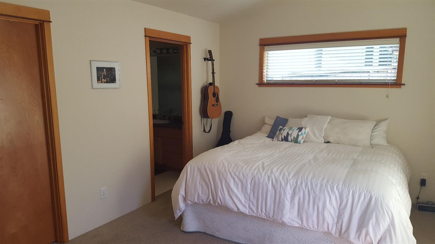 15 Logan Way Talent, OR 97540 - Photo 7 of 9 a bedroom with a bed and a window