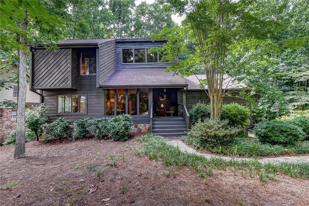 215 Spring Ridge Drive Roswell, GA 30076 - Photo 1 of 1 Nestled on a wooded, private lot, this soft-California Contemporary home is going to make you say WOW when you walk in the door!!
