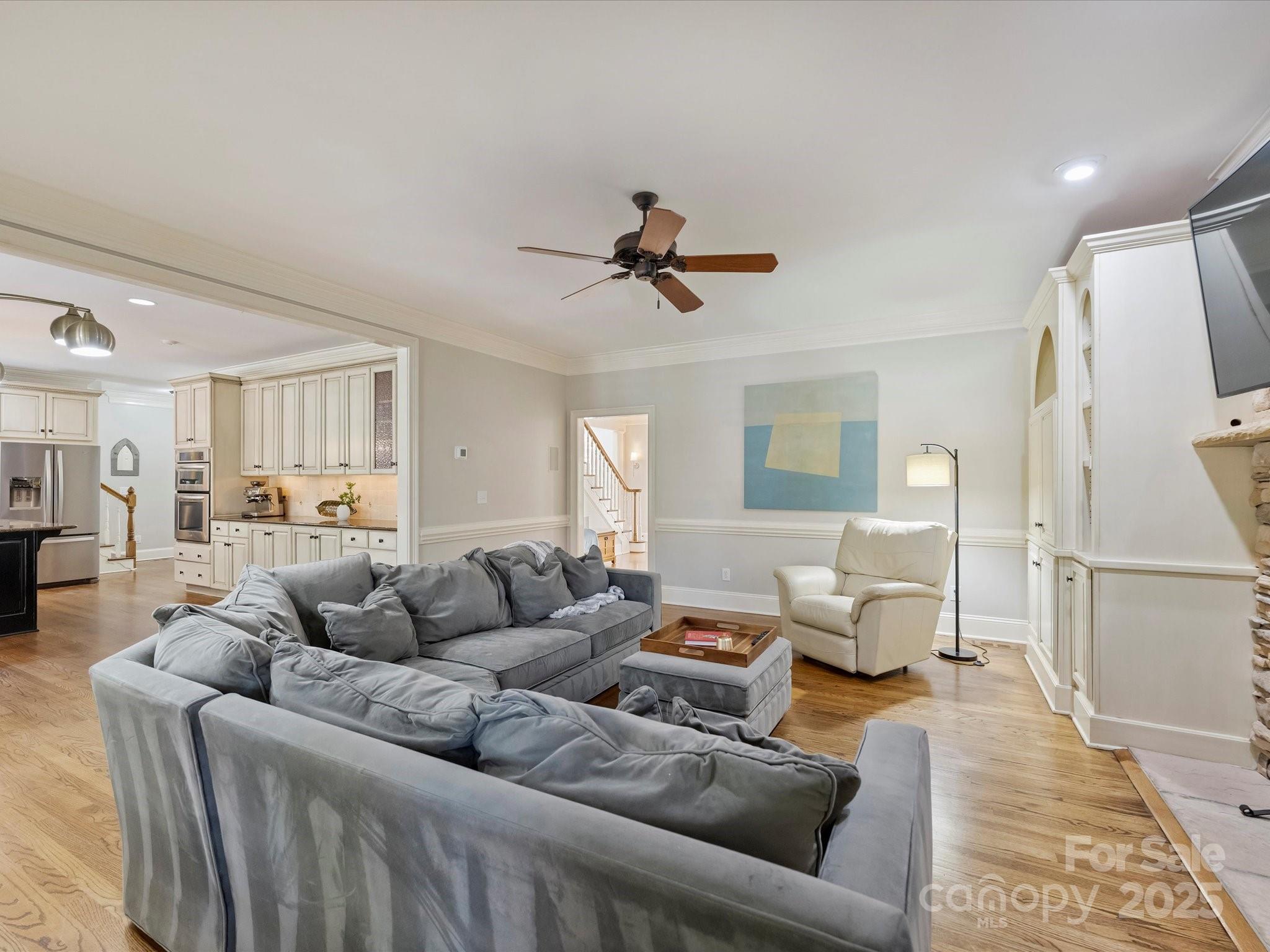 1738 Bardstown Road Charlotte, NC 28226 - Photo 14 of 40 a living room with furniture and a wooden floor