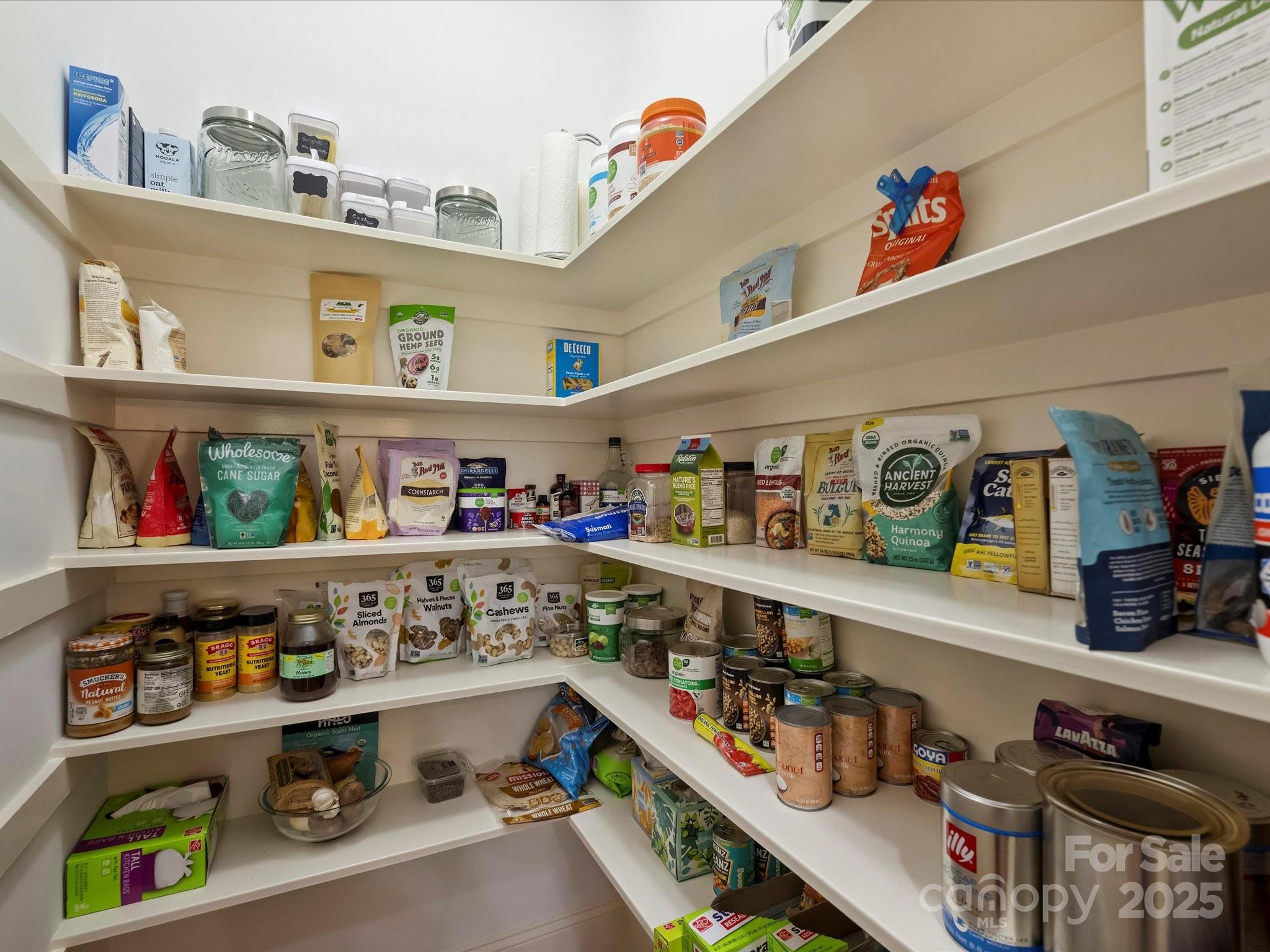 1738 Bardstown Road Charlotte, NC 28226 - Photo 20 of 40 a kitchen with lots of bottles of alcohol