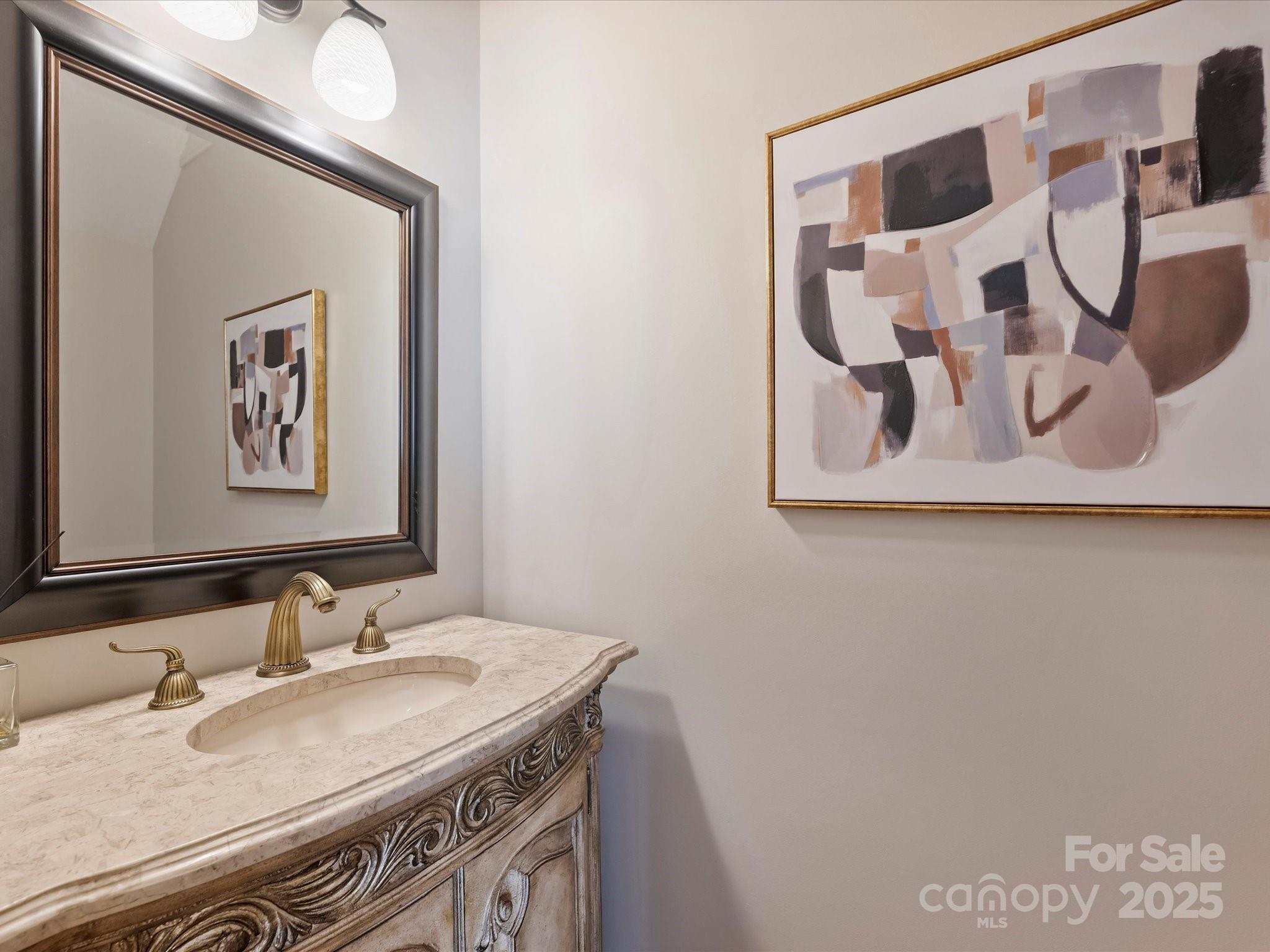 1738 Bardstown Road Charlotte, NC 28226 - Photo 21 of 40 a bathroom with a granite countertop sink and a mirror