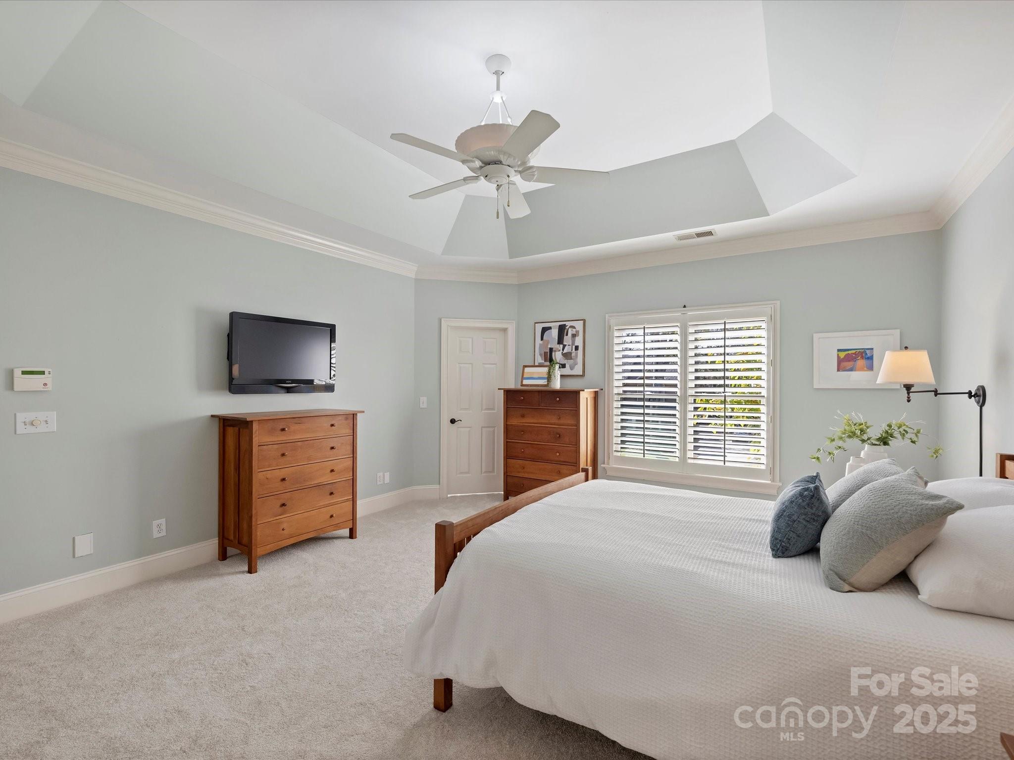 1738 Bardstown Road Charlotte, NC 28226 - Photo 24 of 40 a bedroom with a bed and a flat screen tv