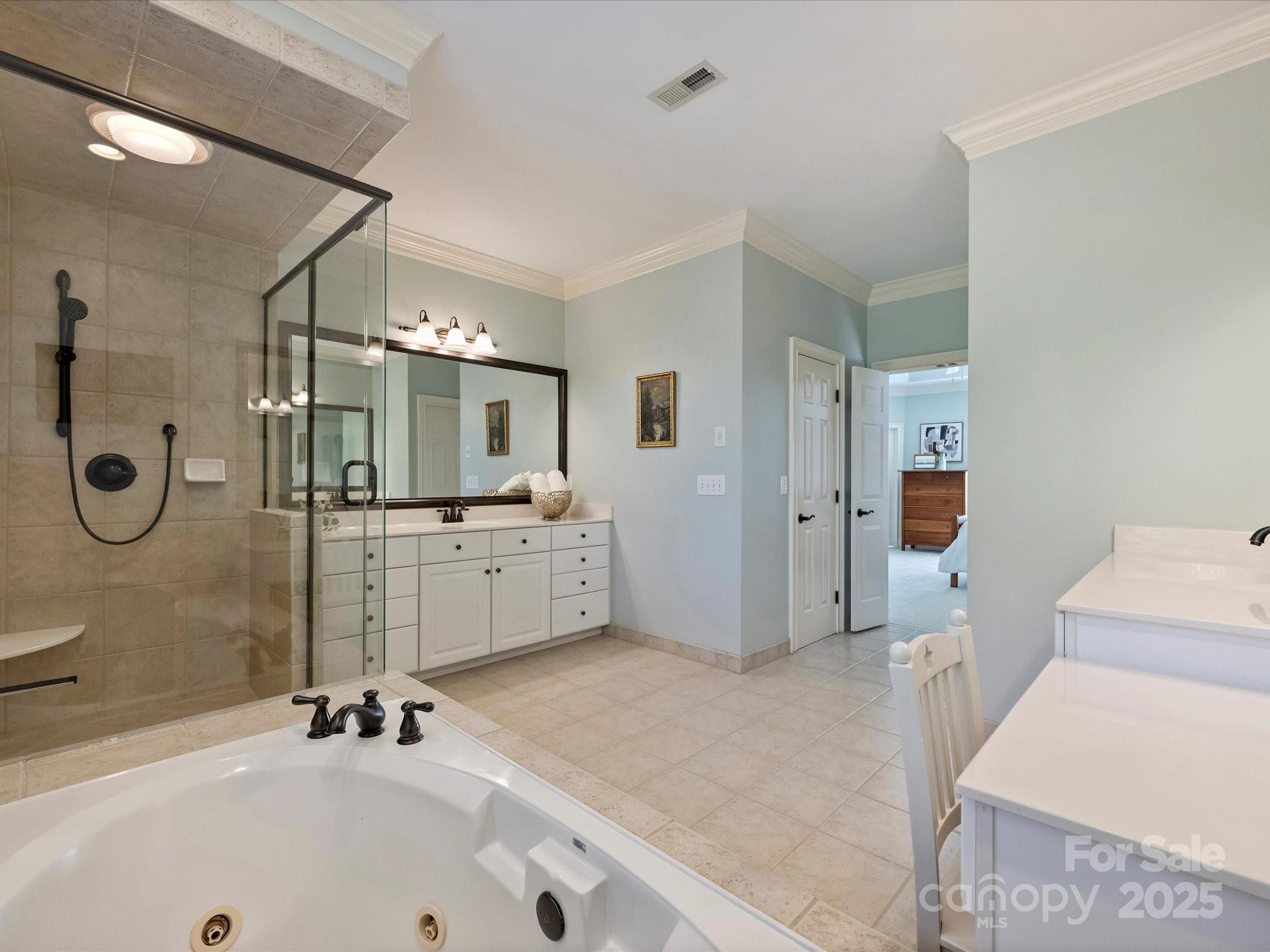 1738 Bardstown Road Charlotte, NC 28226 - Photo 27 of 40 a bathroom with a tub sink and mirror