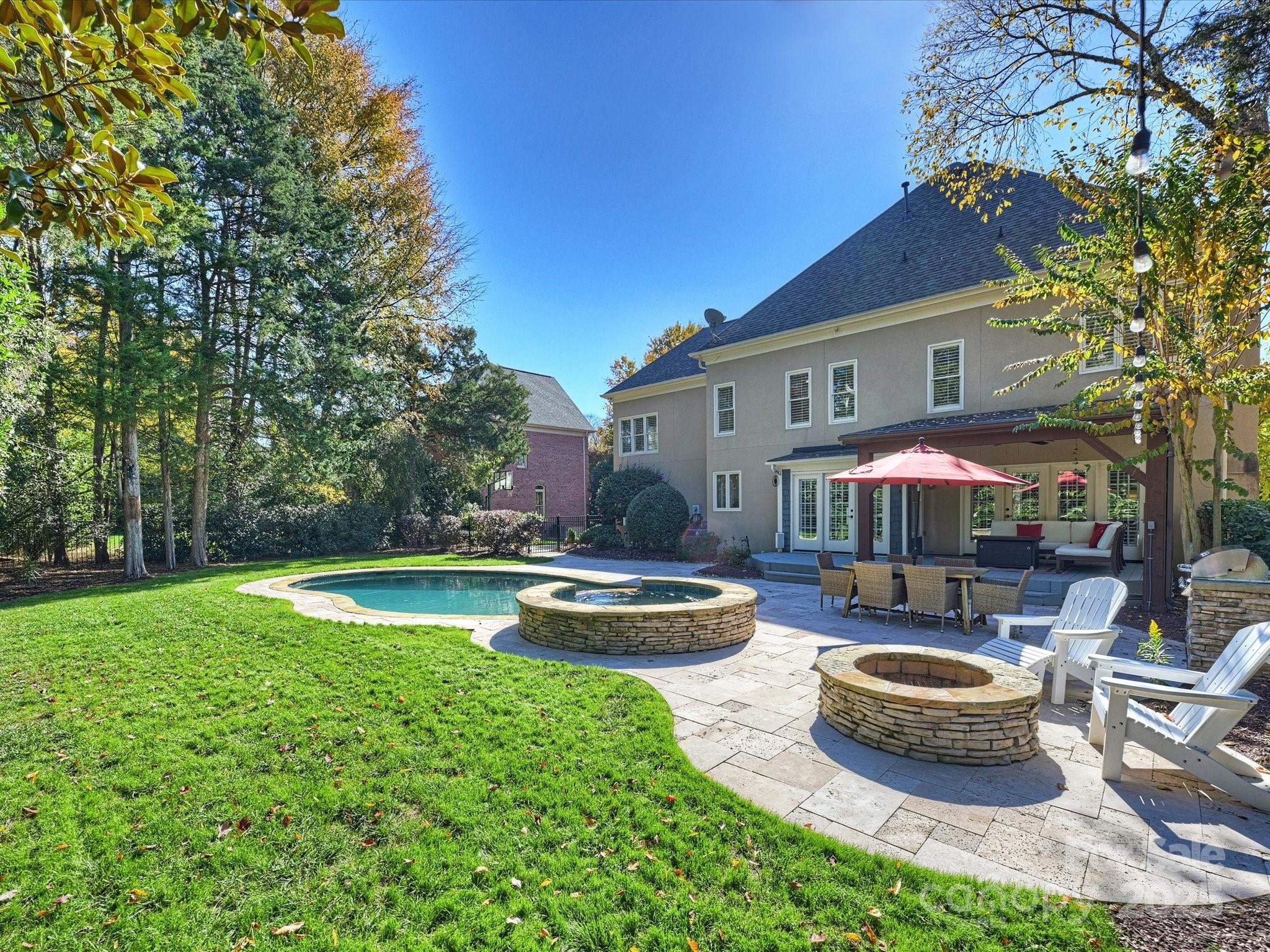 1738 Bardstown Road Charlotte, NC 28226 - Photo 36 of 40 a front view of a house with swimming pool garden and patio