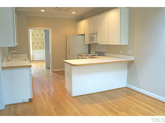 7624 Wilderness Road Raleigh, NC 27613 - Photo 13 of 25 Kitchen View from the breakfast room into the kitchen. Kitchen