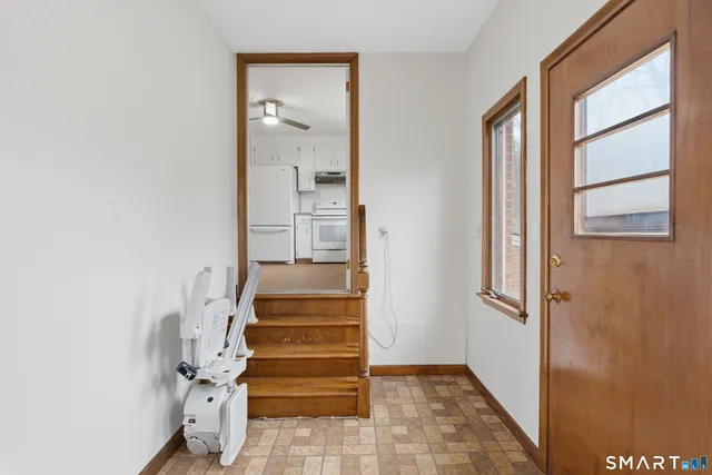 a view of entryway and hall with a window