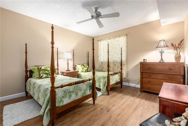 a bed room with a bed and a television