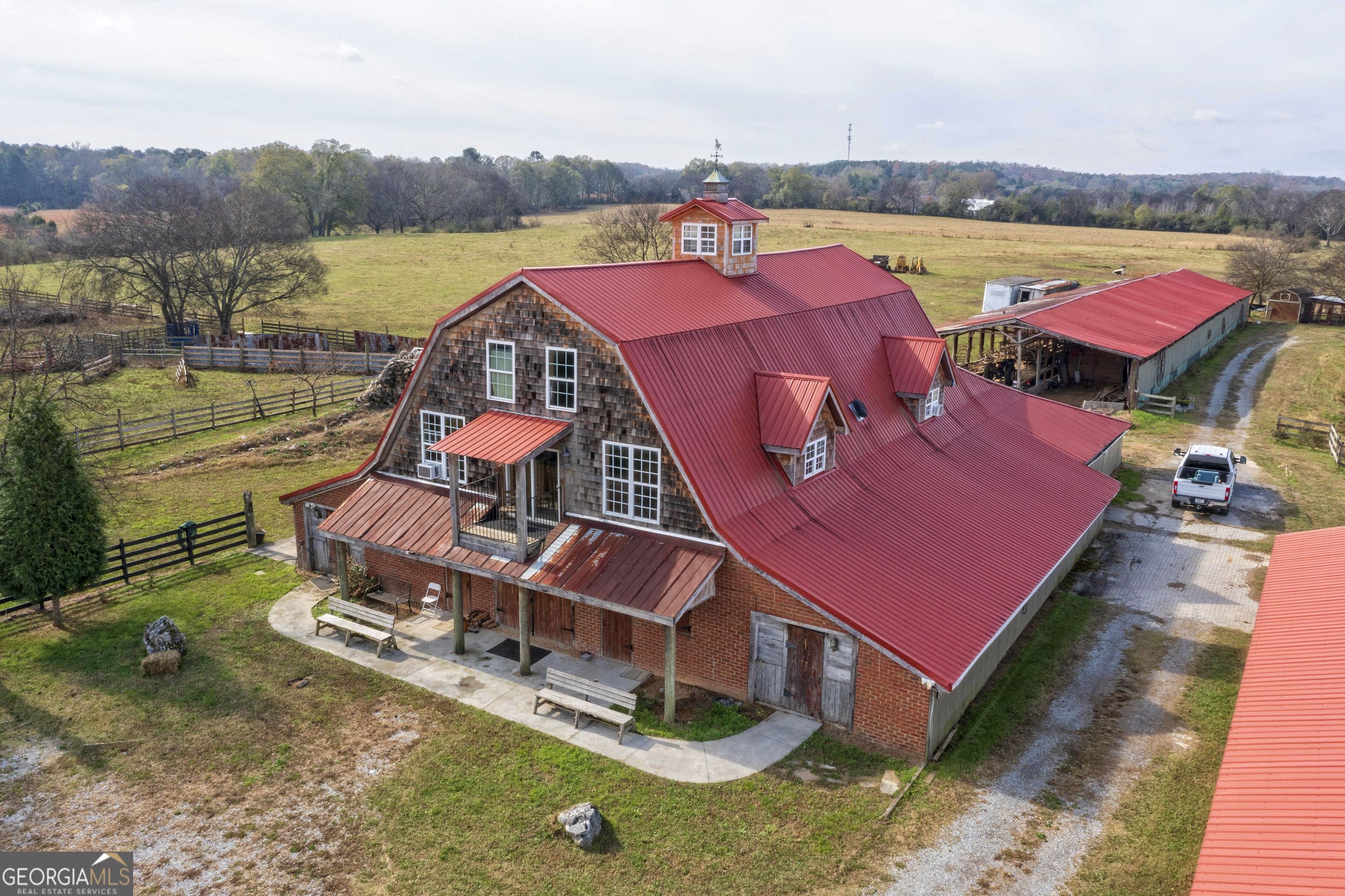 an aerial view of a house with outdoor space and lake view