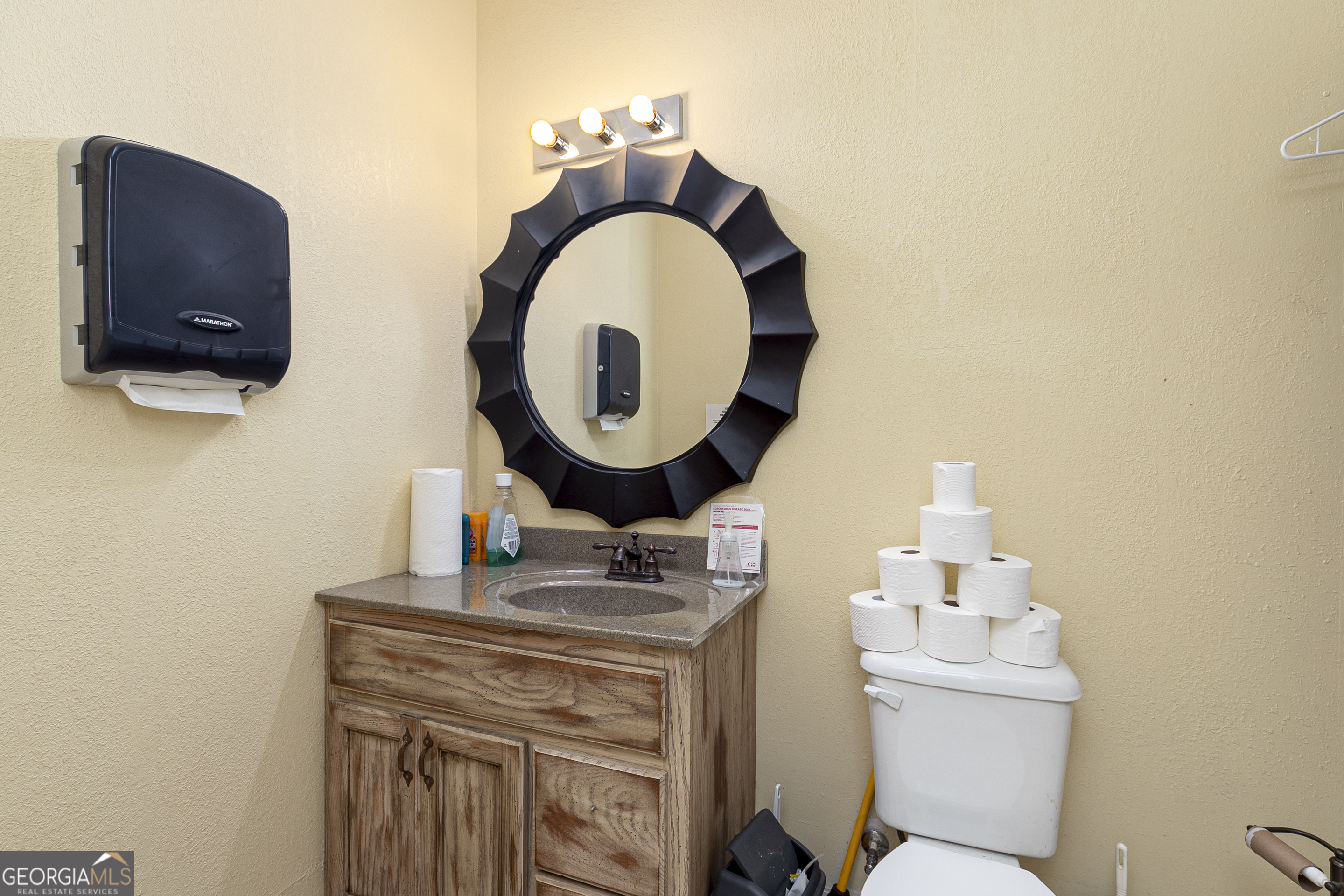 1907 Old Cedartown Road Cedartown, GA 30125 - Photo 12 of 83 a bathroom with a toilet a sink and a mirror