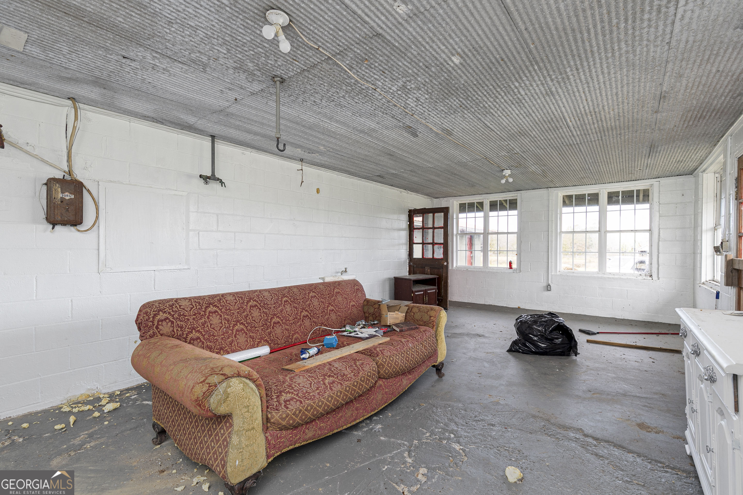 1907 Old Cedartown Road Cedartown, GA 30125 - Photo 23 of 83 a living room with furniture gym equipment and a window