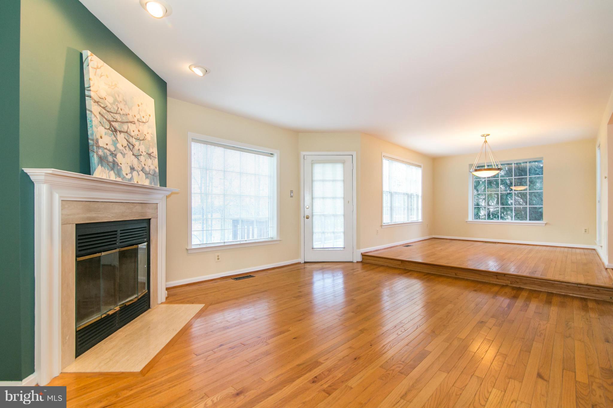 1510 Deer Point Way Reston, VA 20194 - Photo 5 of 30 a view of an empty room with wooden floor and a window