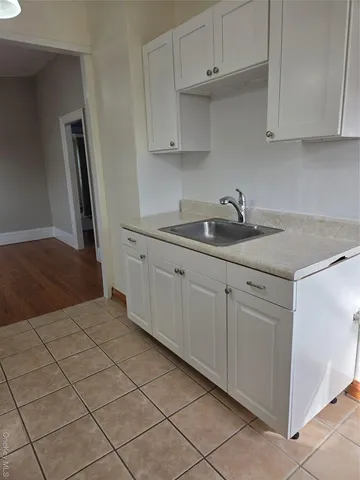 an empty room with a fireplace