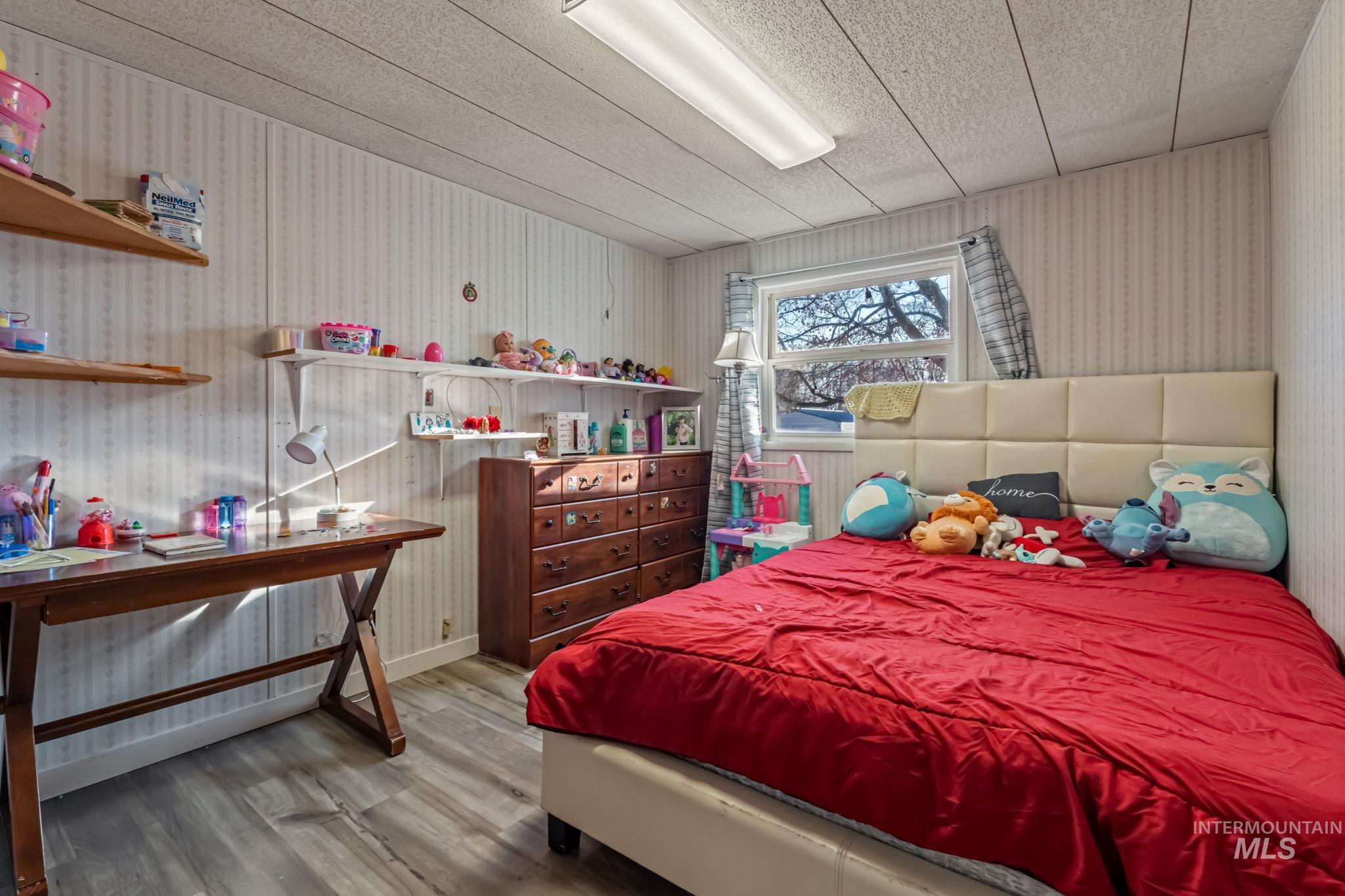 11234 George Street Nampa, ID 83651 - Photo 20 of 25 Bedroom with light wood-type flooring and baseboards
