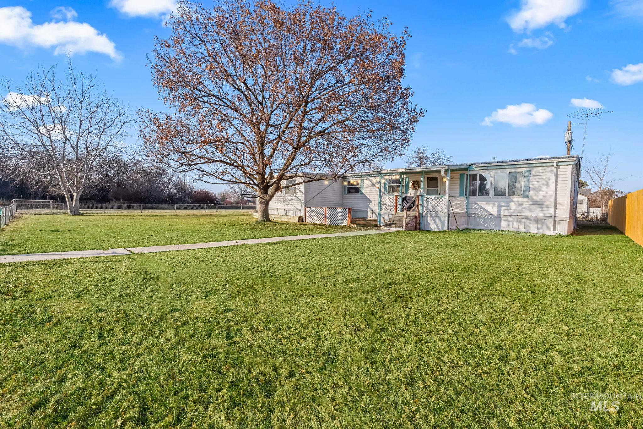 11234 George Street Nampa, ID 83651 - Photo 2 of 25 Back of property featuring a fenced backyard