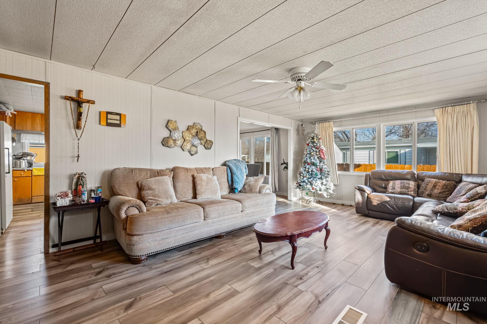 11234 George Street Nampa, ID 83651 - Photo 9 of 25 Living room featuring a ceiling fan and wood finished floors