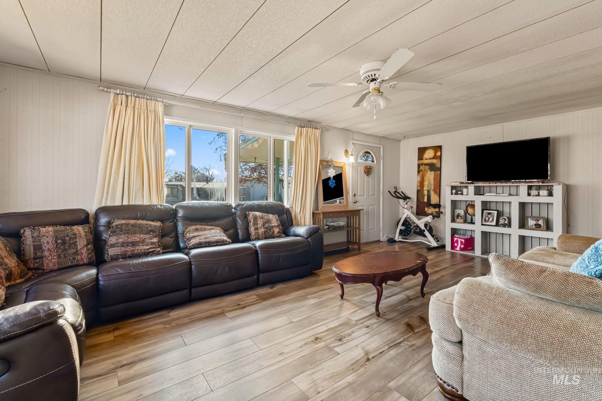 11234 George Street Nampa, ID 83651 - Photo 10 of 25 Living room featuring wood-type flooring and ceiling fan