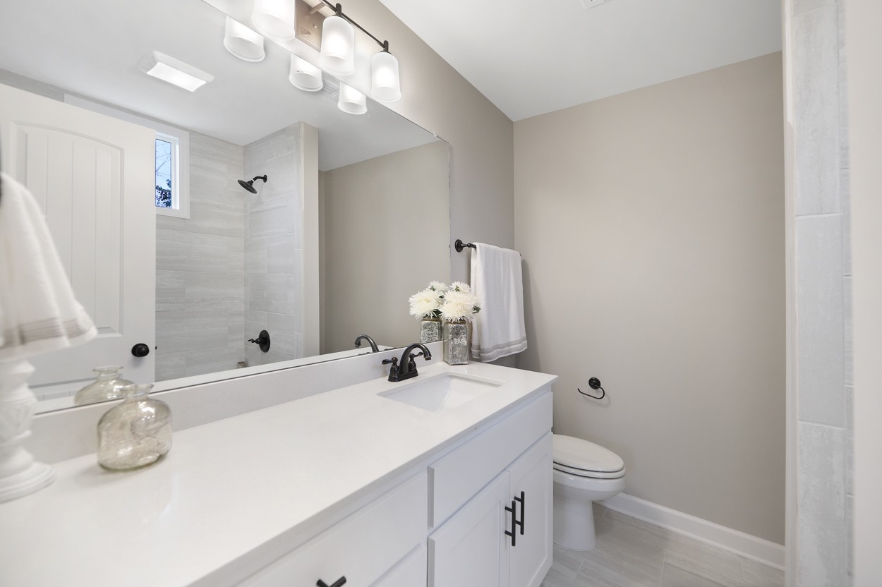 25 Riadon Road Hartsville, TN 37074 - Photo 14 of 19 a bathroom with a sink a toilet and shower