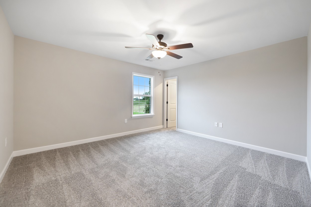 25 Riadon Road Hartsville, TN 37074 - Photo 16 of 19 an empty room with windows and fan