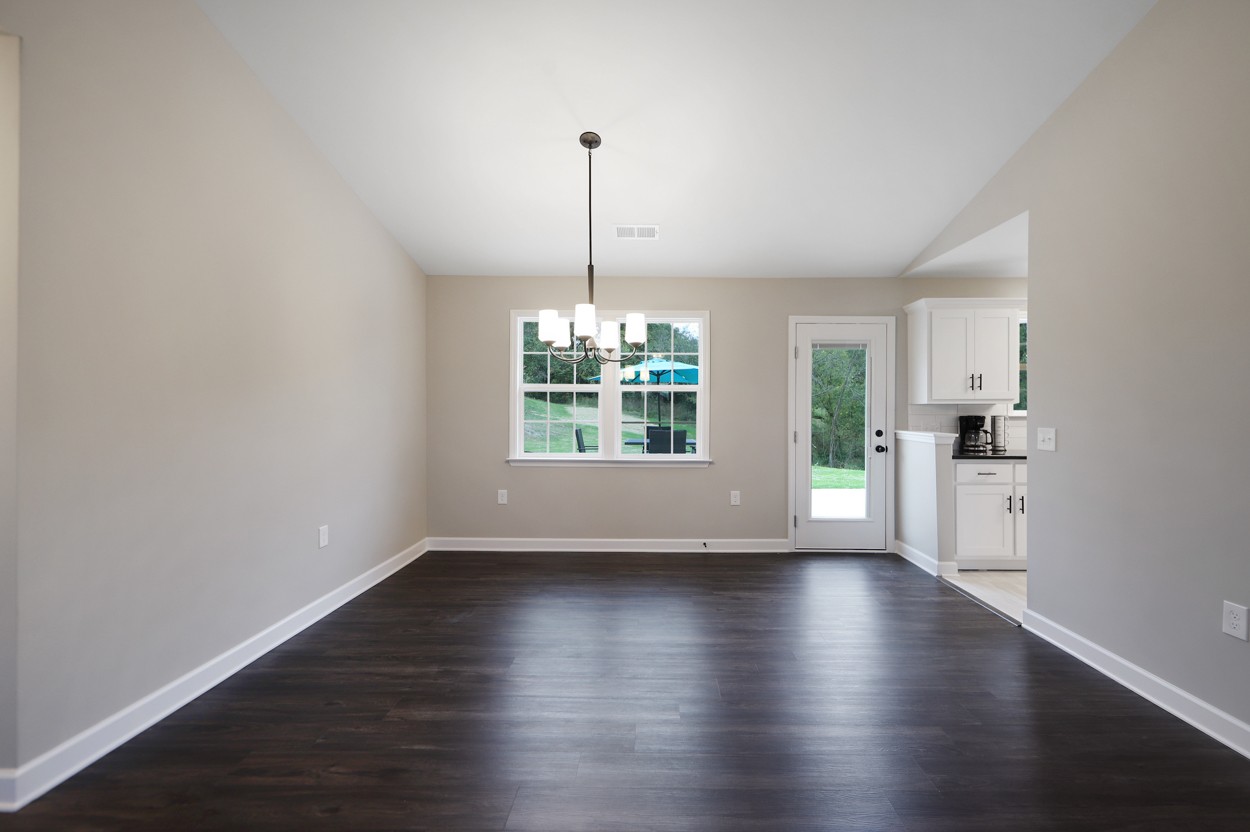 25 Riadon Road Hartsville, TN 37074 - Photo 9 of 19 a view of an empty room with wooden floor and a window