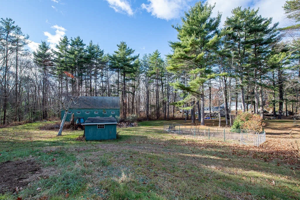 16 Killam Hill Road Boxford, MA 01921 - Photo 16 of 34 a backyard of a house with lots of green space and fountain