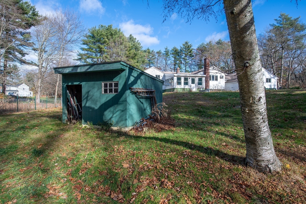 16 Killam Hill Road Boxford, MA 01921 - Photo 24 of 34 a view of a wooden house with a yard