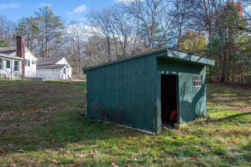 16 Killam Hill Road Boxford, MA 01921 - Photo 25 of 34 a view of a wooden house with a small yard