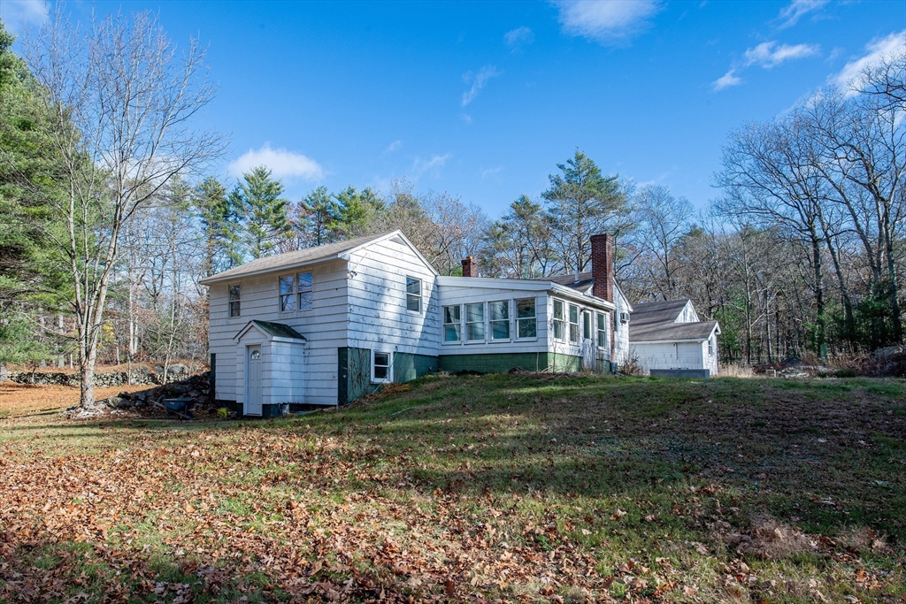 16 Killam Hill Road Boxford, MA 01921 - Photo 28 of 34 a front view of a house with a garden