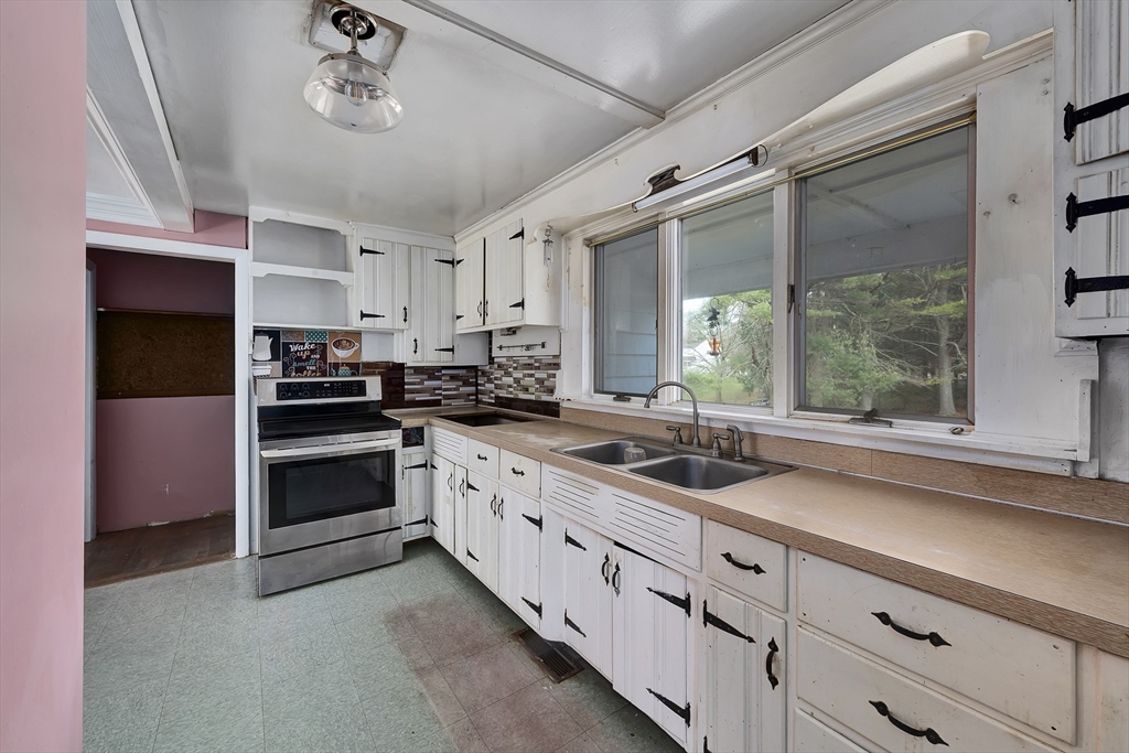 16 Killam Hill Road Boxford, MA 01921 - Photo 4 of 34 a kitchen with a sink cabinets and window