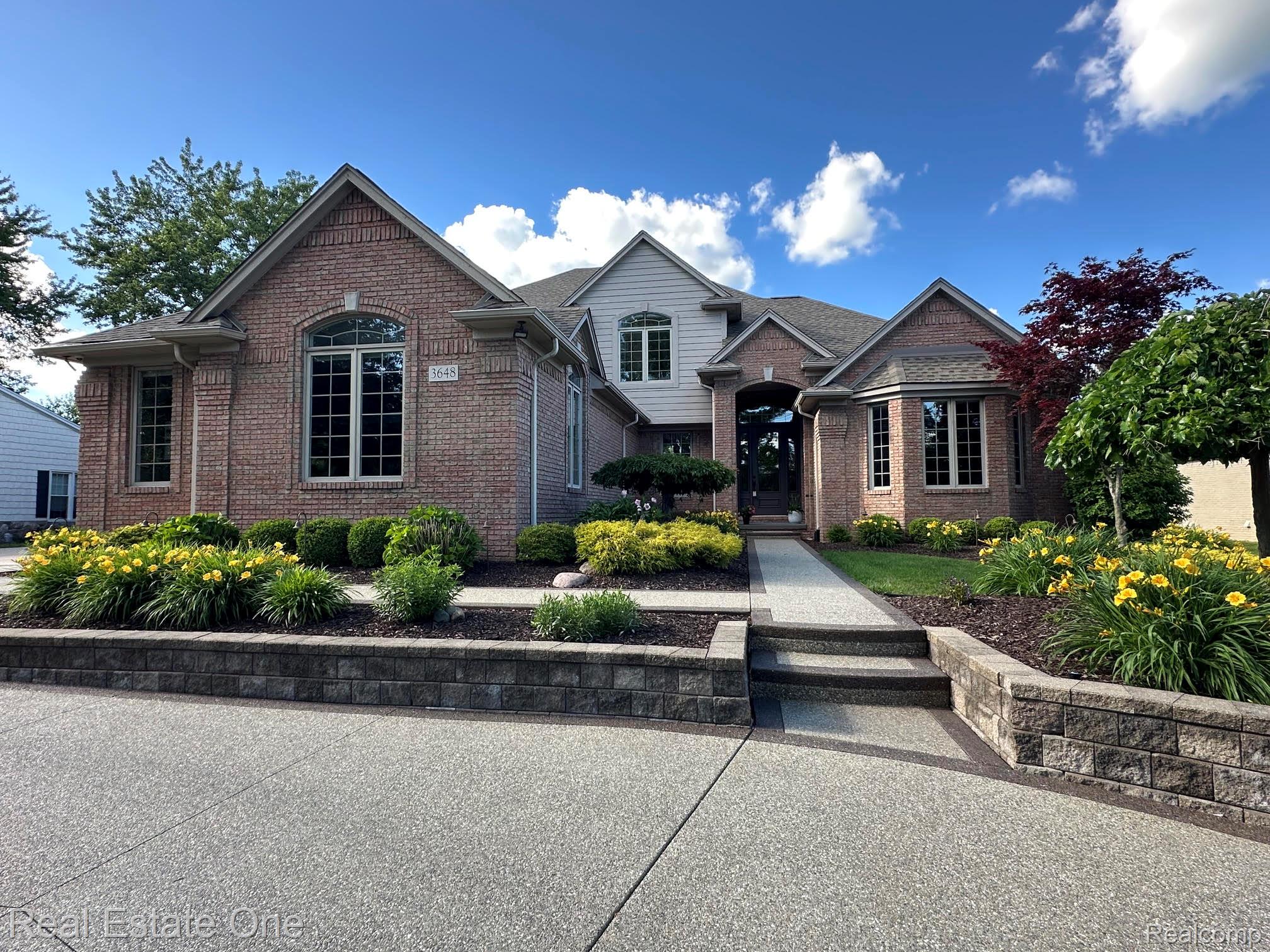 3648 West Tienken Road Rochester, MI 48306 - Photo 2 of 61 Professionally Landscaped with Beautiful Perennial Flowerbeds!
