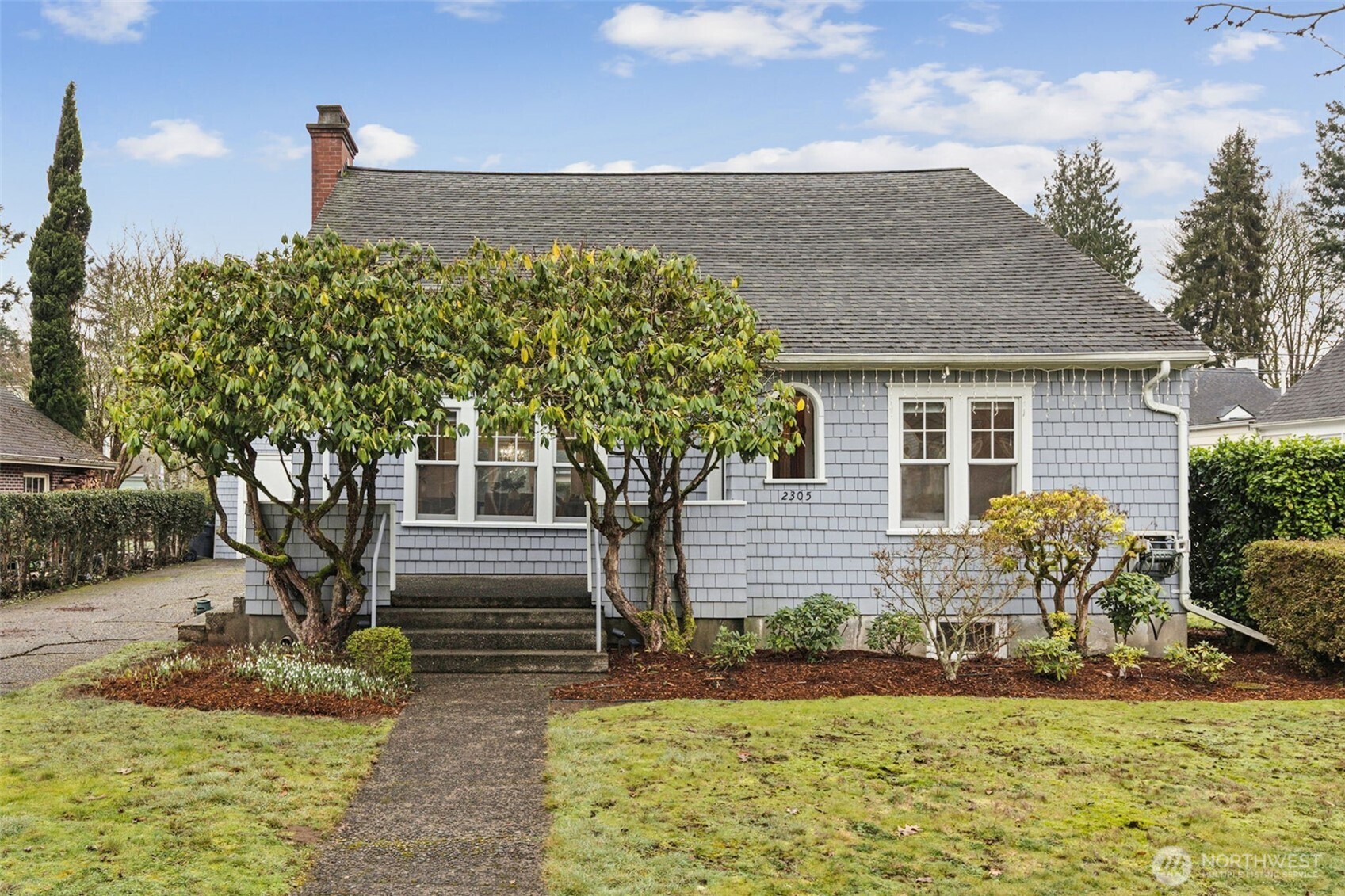 2305 Columbia Street Southwest Olympia, WA 98501 - Photo 1 of 34 a front view of a house with garden