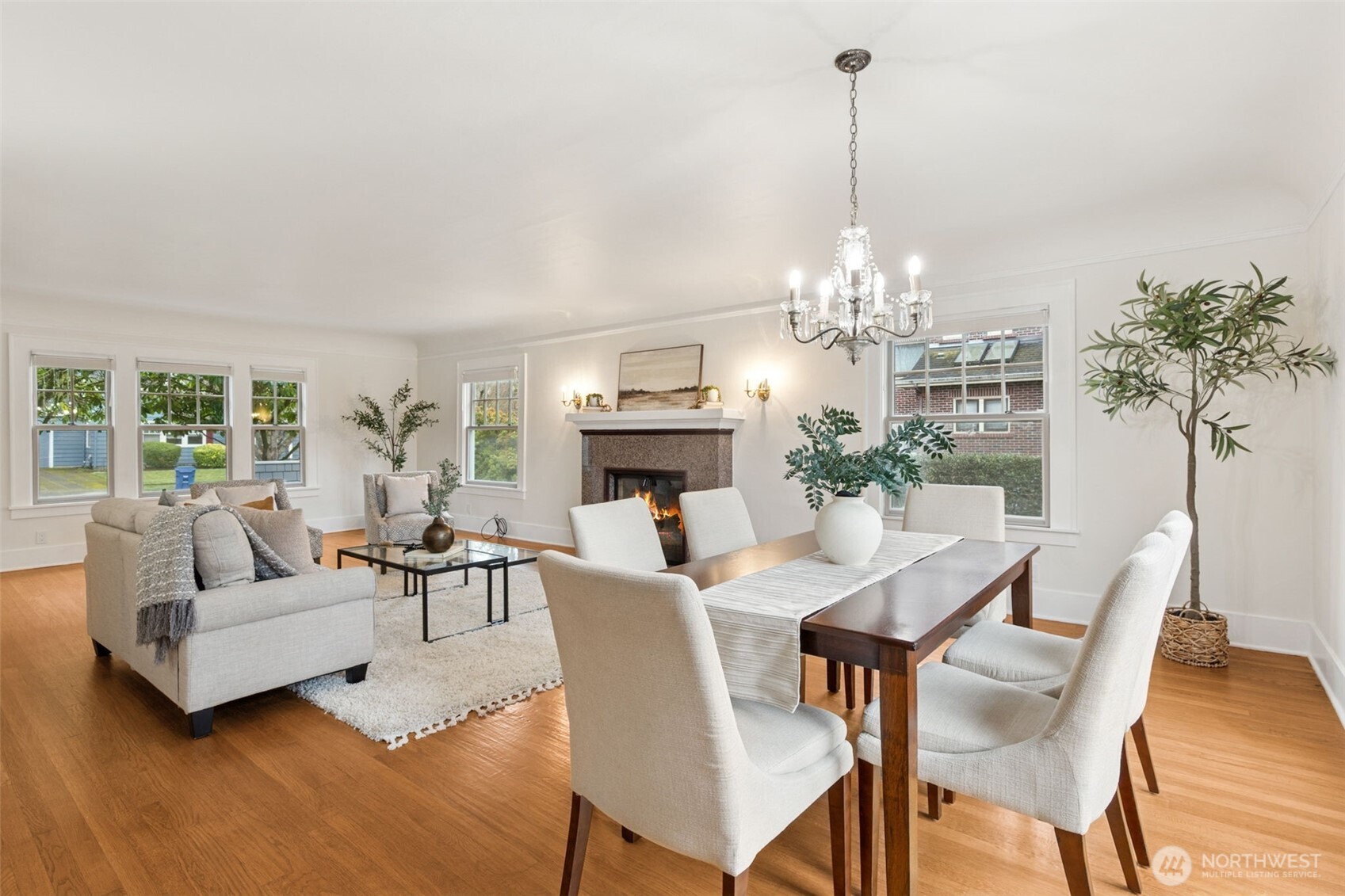 2305 Columbia Street Southwest Olympia, WA 98501 - Photo 13 of 34 a view of a dining room with furniture a chandelier and wooden floor