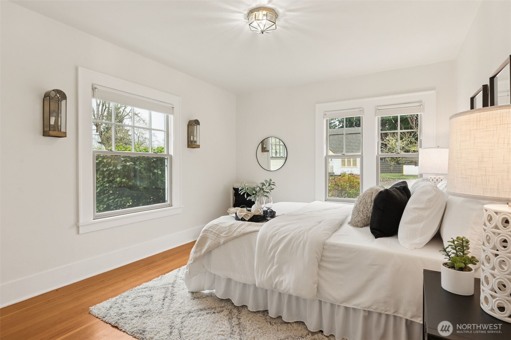 2305 Columbia Street Southwest Olympia, WA 98501 - Photo 15 of 34 a bedroom with a bed lamp and a large window