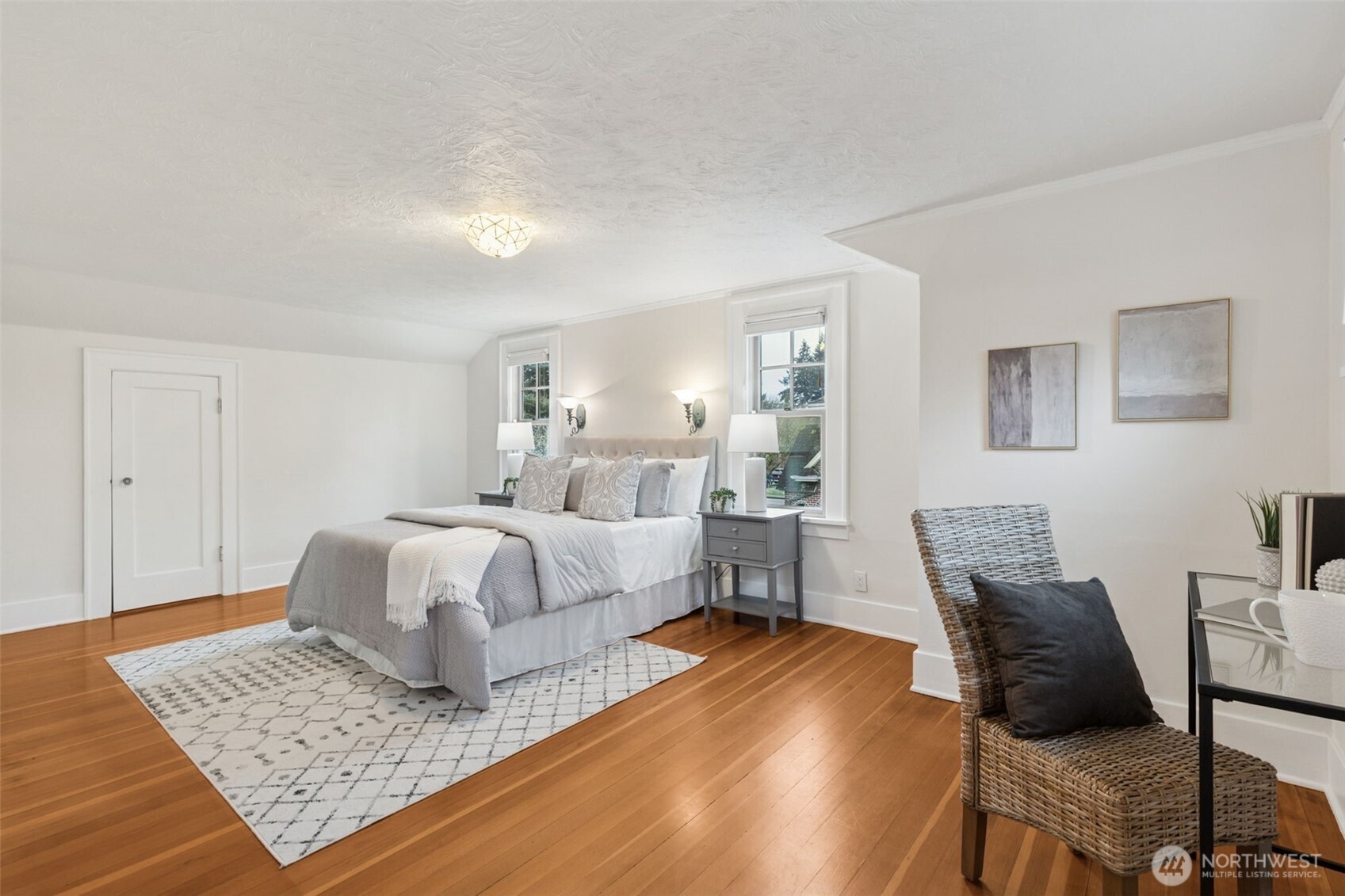 2305 Columbia Street Southwest Olympia, WA 98501 - Photo 20 of 34 a bedroom with a bed and wooden floor