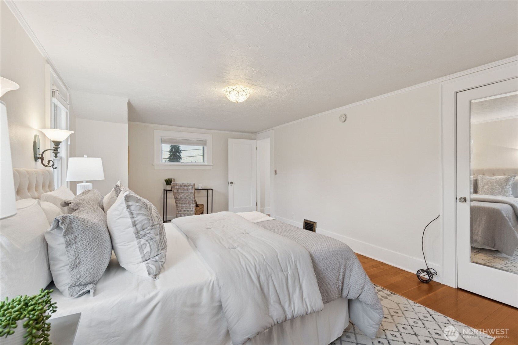 2305 Columbia Street Southwest Olympia, WA 98501 - Photo 21 of 34 a bedroom with a bed and a mirror