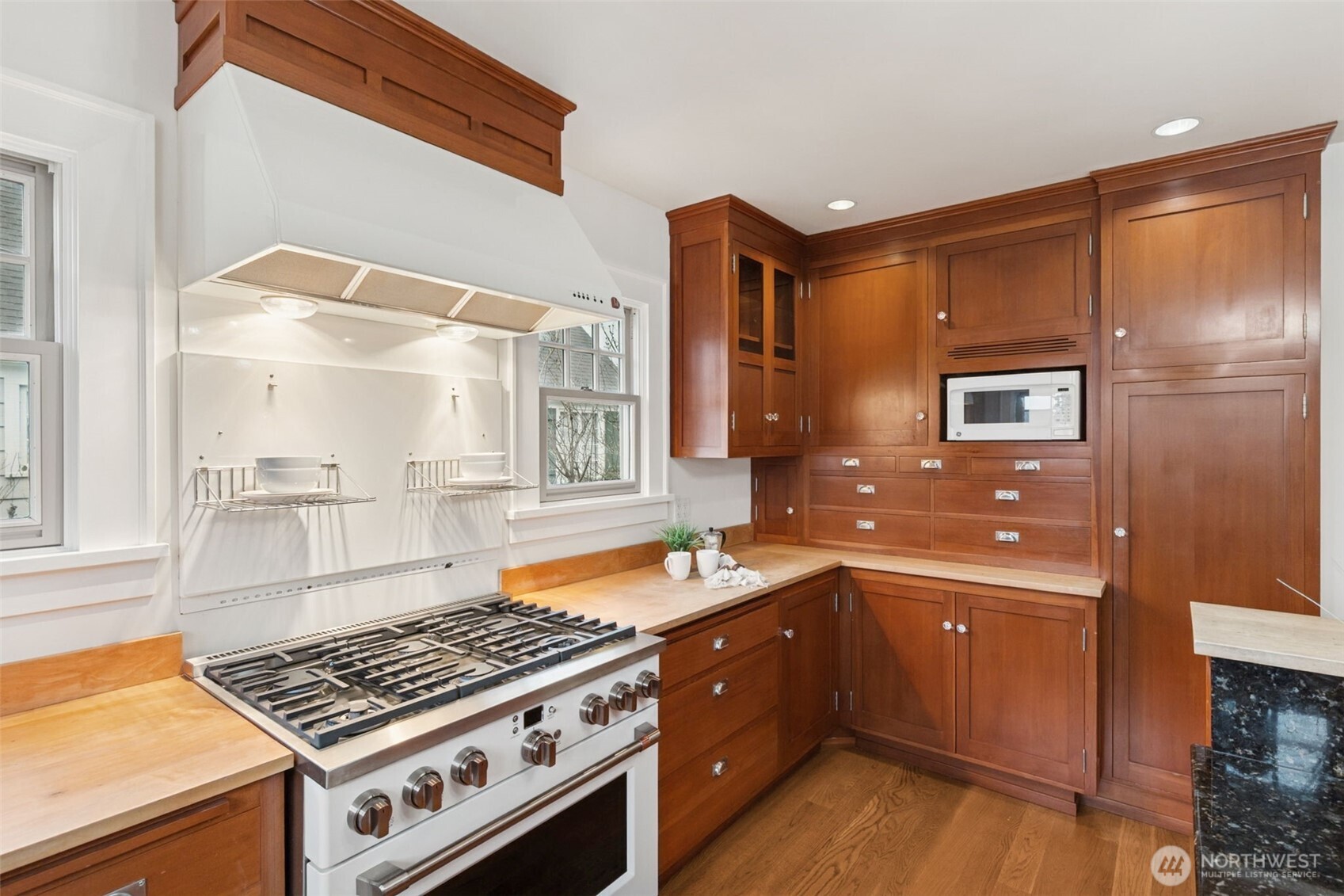 2305 Columbia Street Southwest Olympia, WA 98501 - Photo 6 of 34 a kitchen with granite countertop a sink cabinets and stainless steel appliances