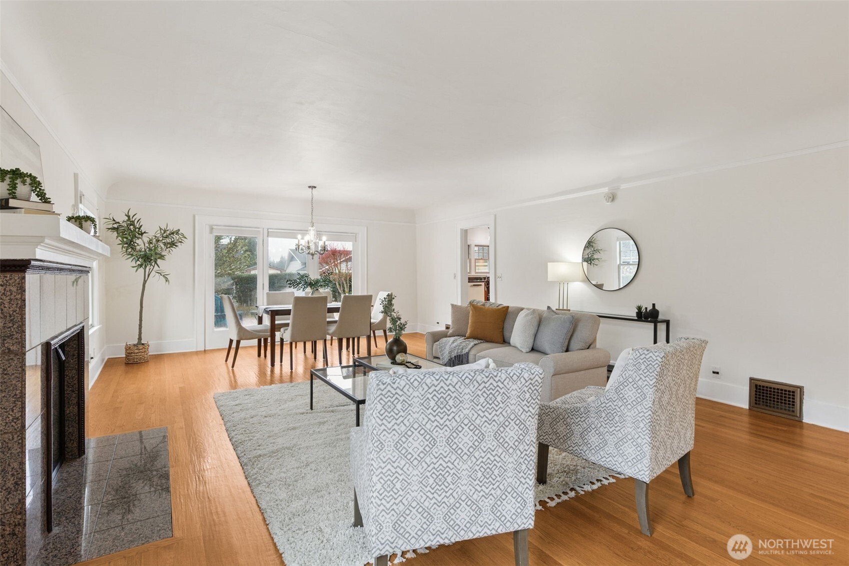 2305 Columbia Street Southwest Olympia, WA 98501 - Photo 8 of 34 a living room with furniture a fireplace and wooden floor